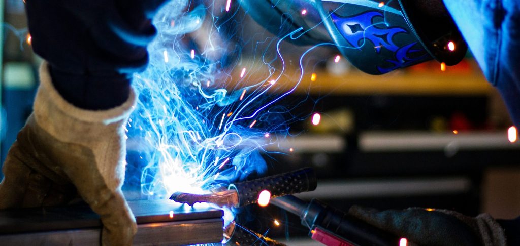 man working on steel frame for R&D