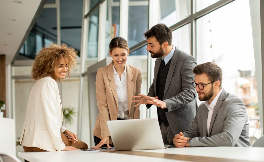 4 office workers in a meeting