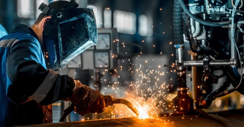 man welds at the factory